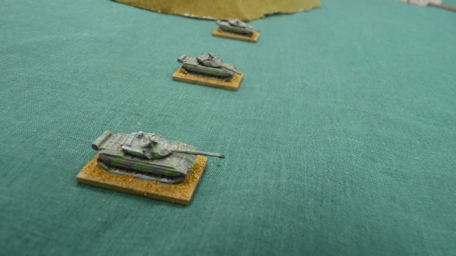 Chinese tanks enter the table and advance close to the steep hill